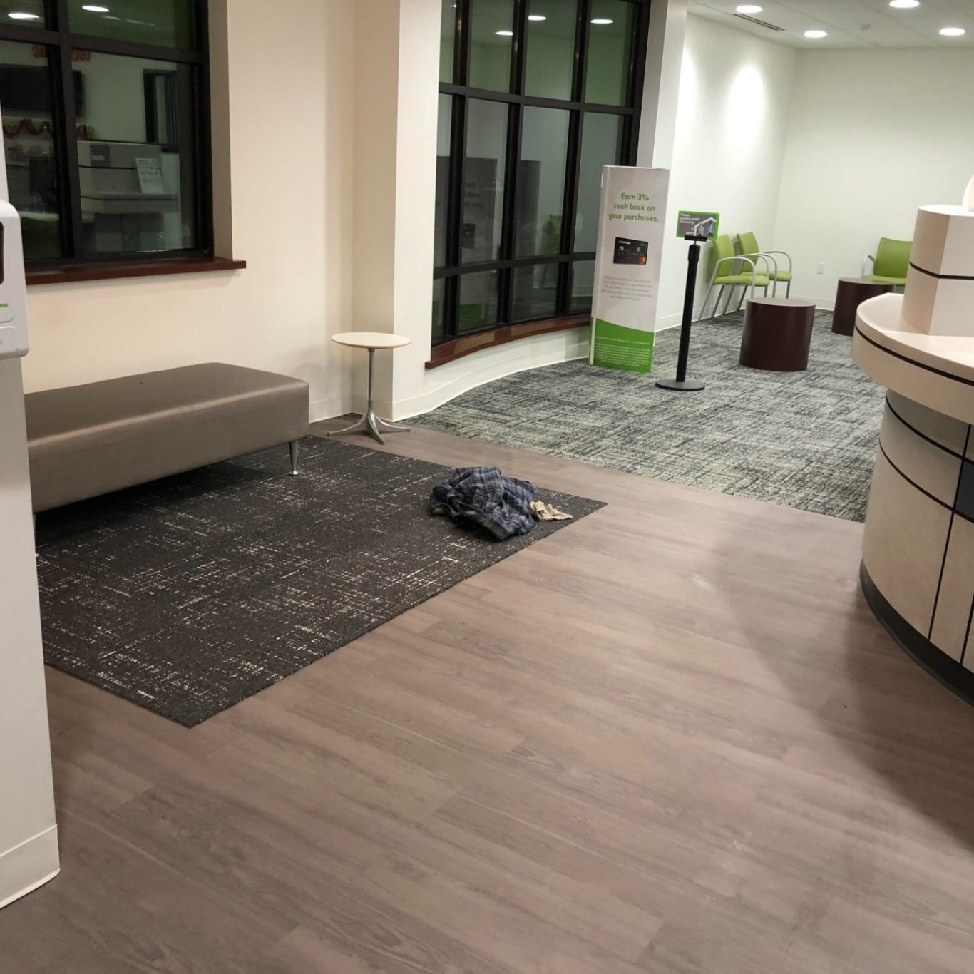 Resurfaced finished concrete floor with vinyl and carpet planks installed Vinyl plank installation